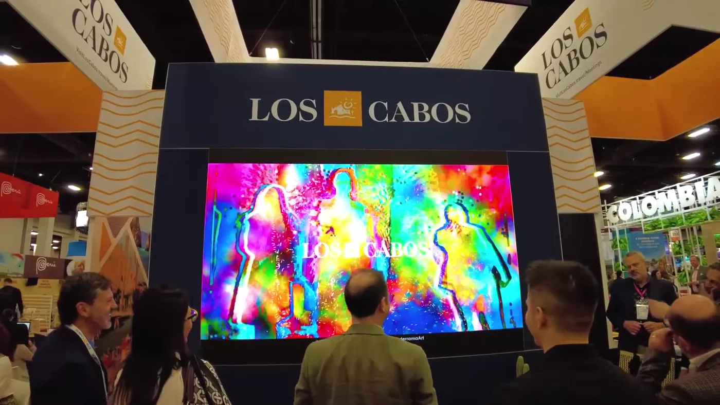 Group silhouettes painted in vibrant color at IMEX